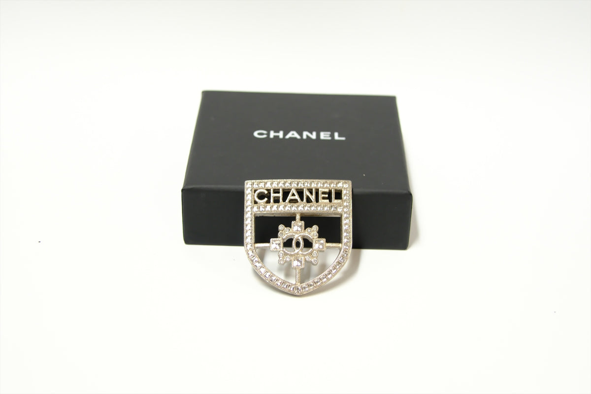 CHANEL SHIELD BROOCH WITH CRYSTALS SHW