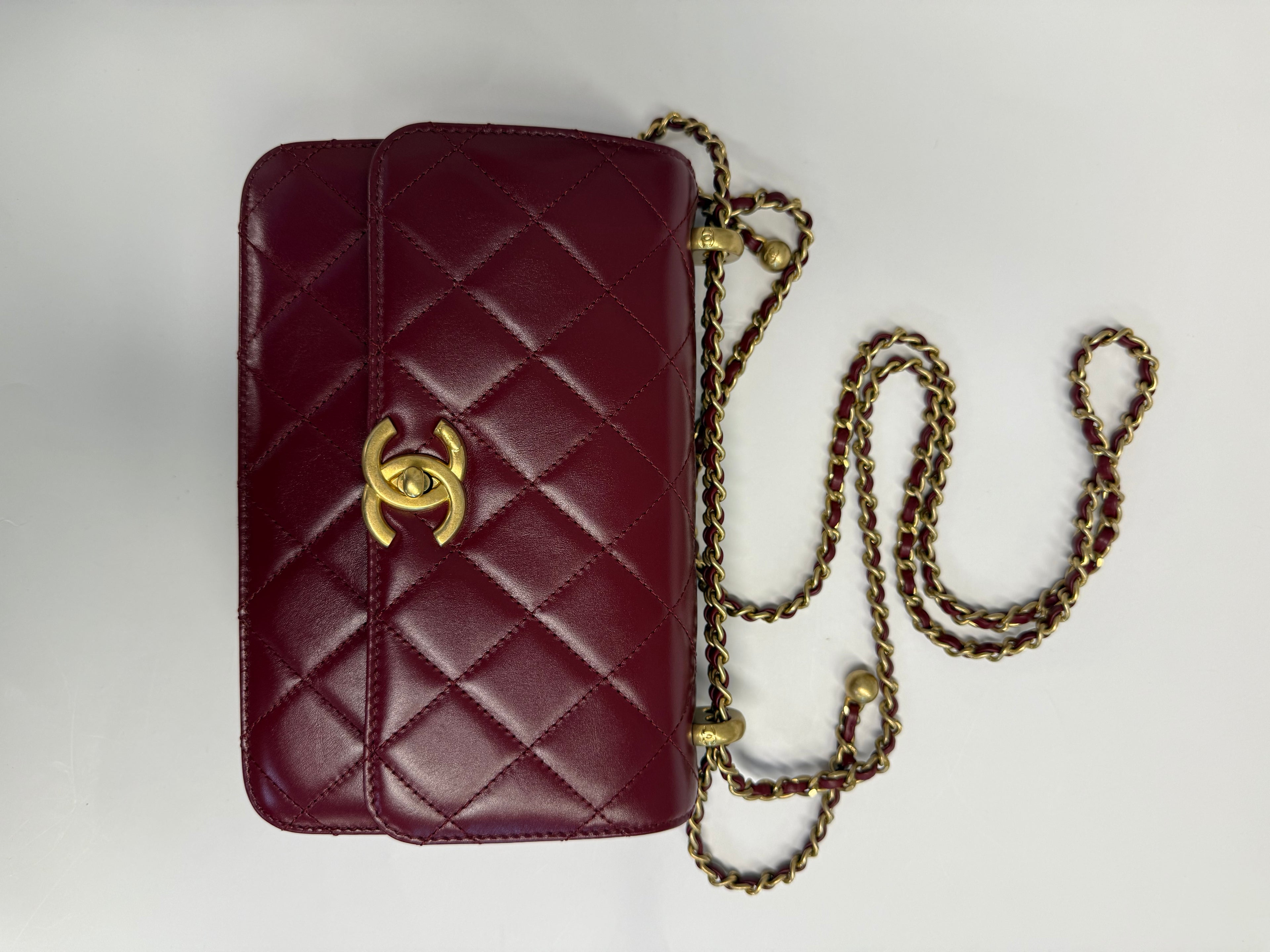 CHANEL 21A MEDIUM GOLD CRUSH FLAP BAG CALFSKIN BURGUNDY GHW 134887426