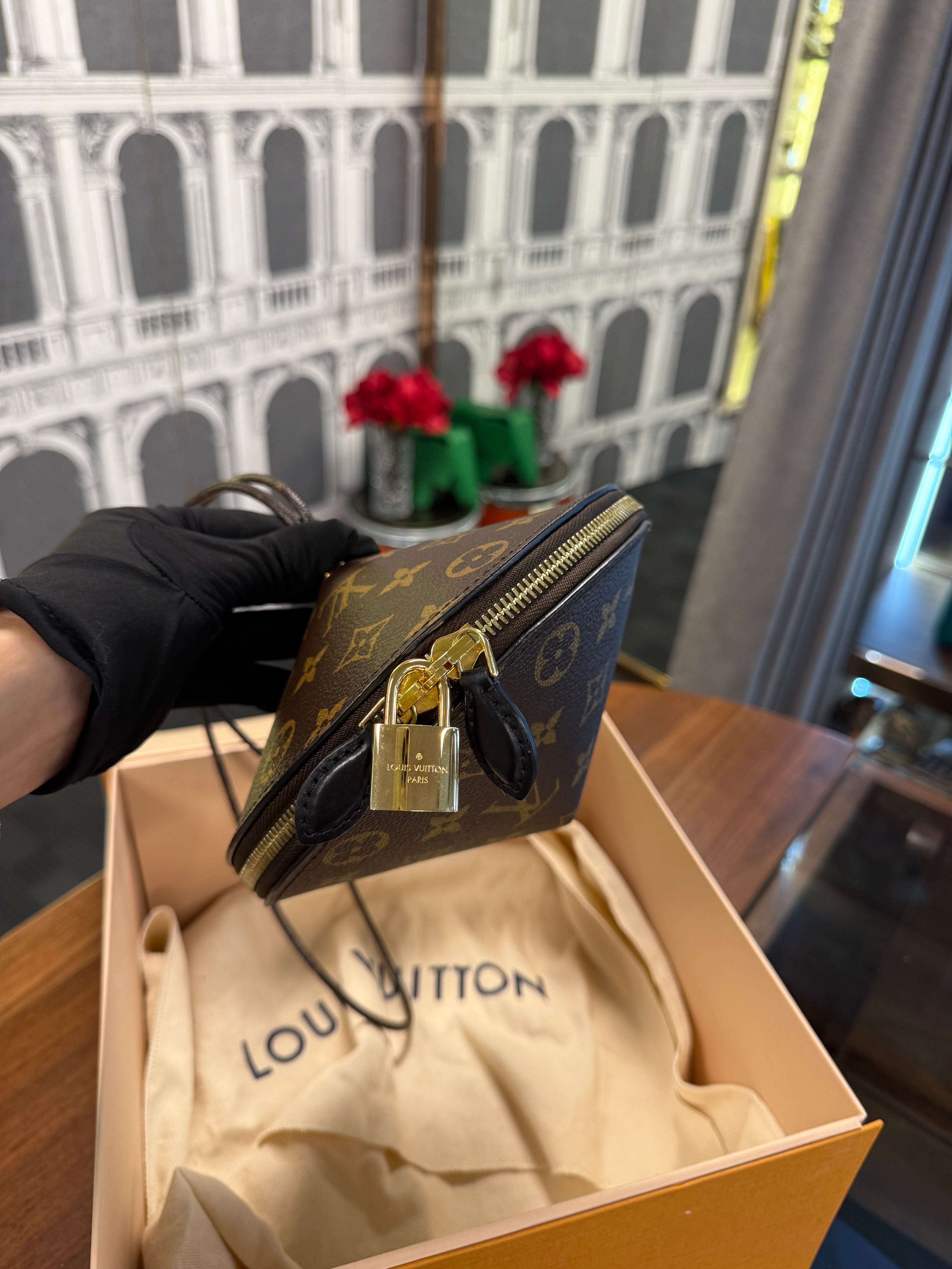 LOUIS VUITTON TOUPIE MONOGRAM CLUTCH BAG