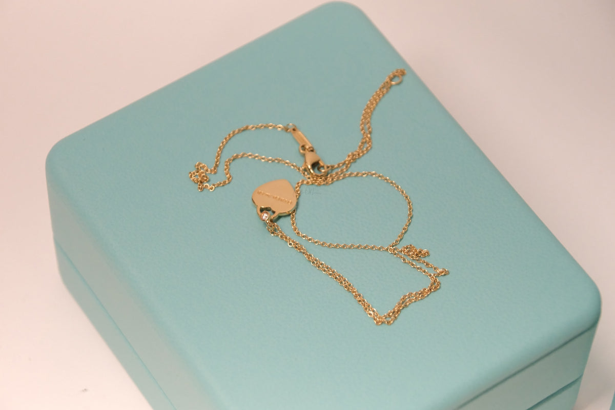 Tiffany & Co Mini Heart Tag Pendant in Yellow Gold with a Diamond