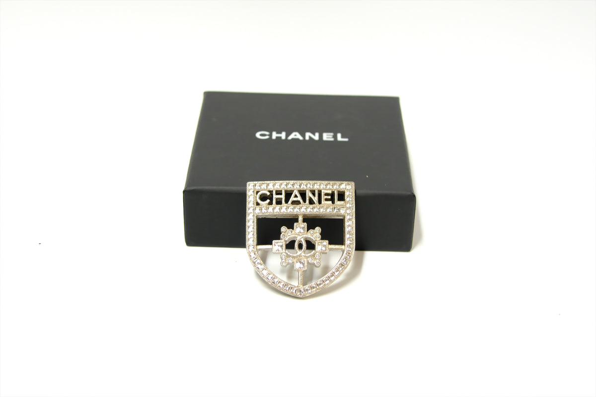 CHANEL SHIELD BROOCH WITH CRYSTALS SHW