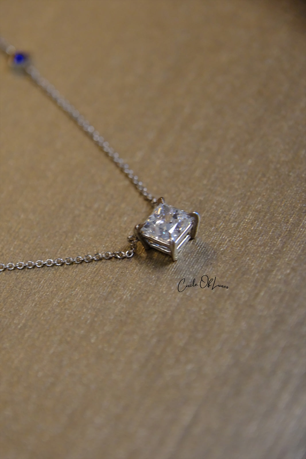 18ct White Gold Diamond and Sapphire pendant.