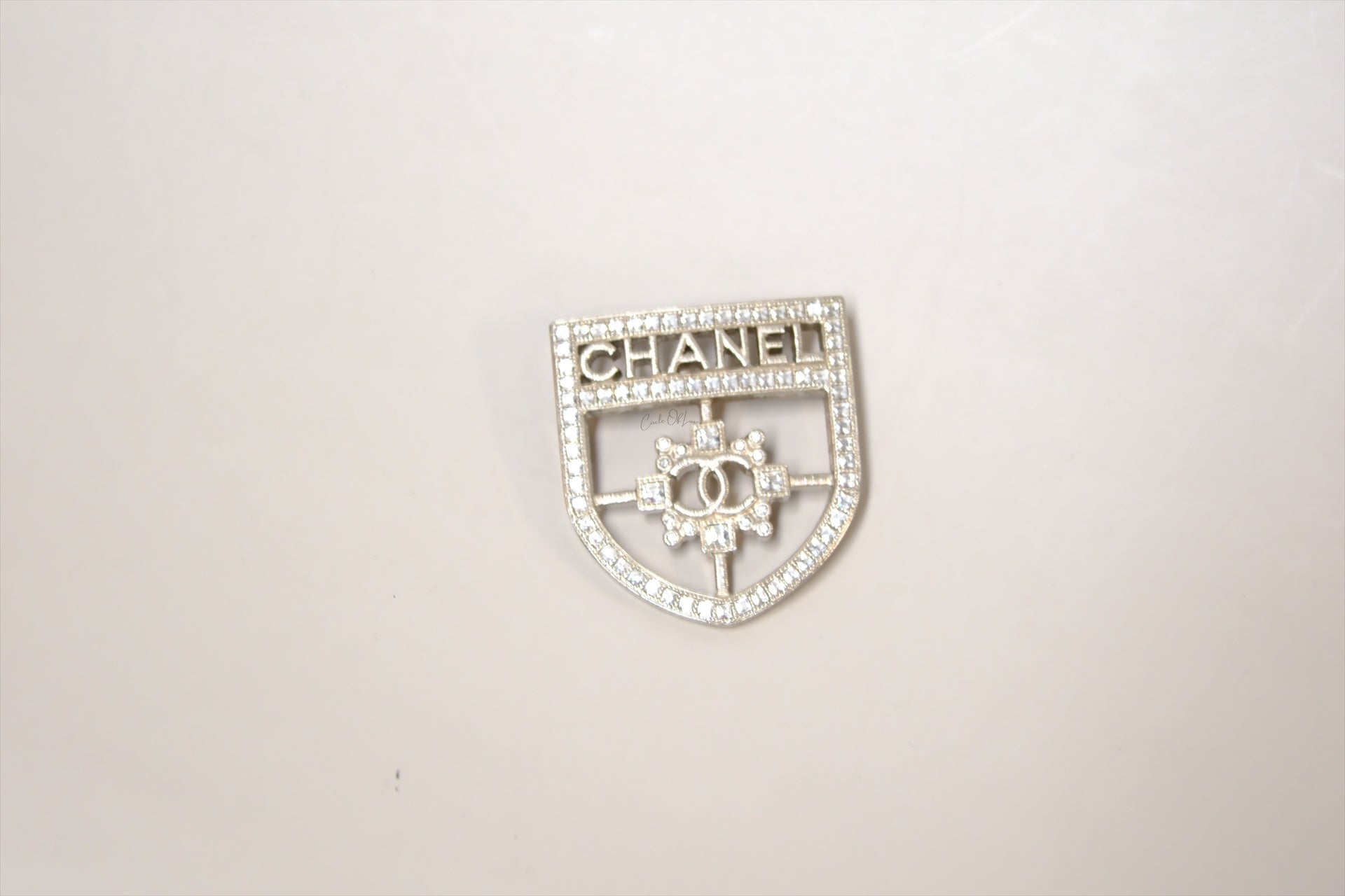 CHANEL SHIELD BROOCH WITH CRYSTALS SHW